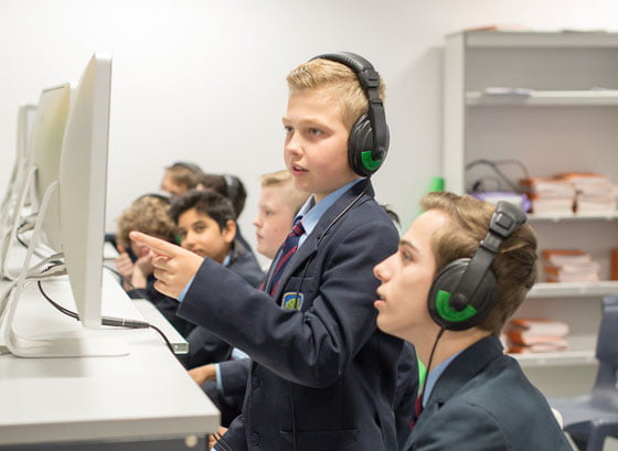 Boys viewing computer